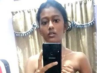 Bare Indian teenage takes solo MMS of