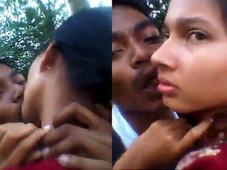 Romantic duo smooching fervently in an
