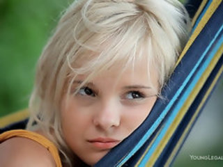 Young doll studies her sexiness in