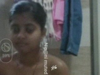 Naked Indian woman enjoys a  bathtub in