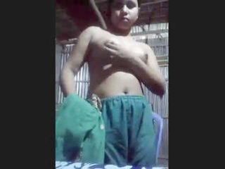 A bare damsel from a ghetto disrobes and