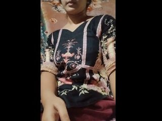 Indian teenage  herself with toys and