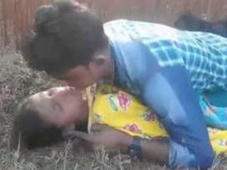 Indian village couple engages in outdoor