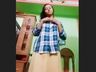 A pretty youthfull Indian doll disrobes