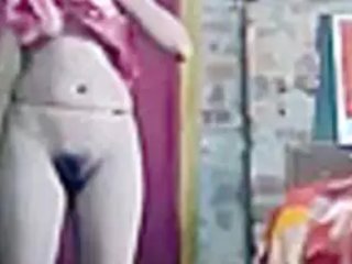 A solo Indian damsel poses bare after